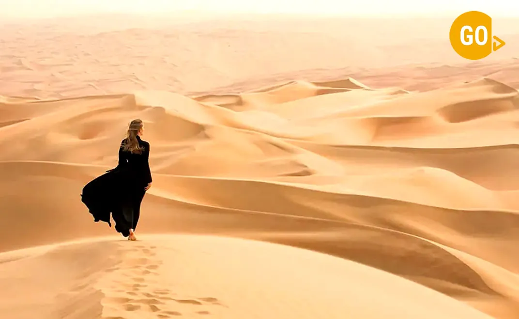 Woman In Desert At Empty Quarter Gallery
