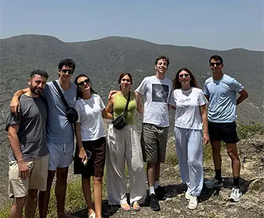 Group of friends hiking in mountains.