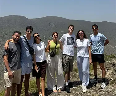 Group of friends hiking in mountains.
