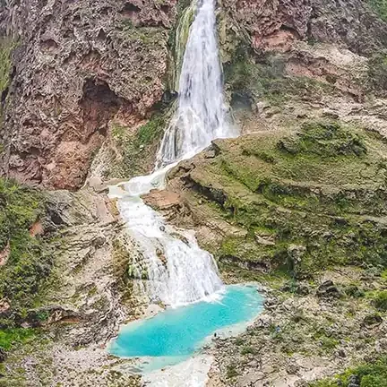 Stunning waterfall with turquoise pool.